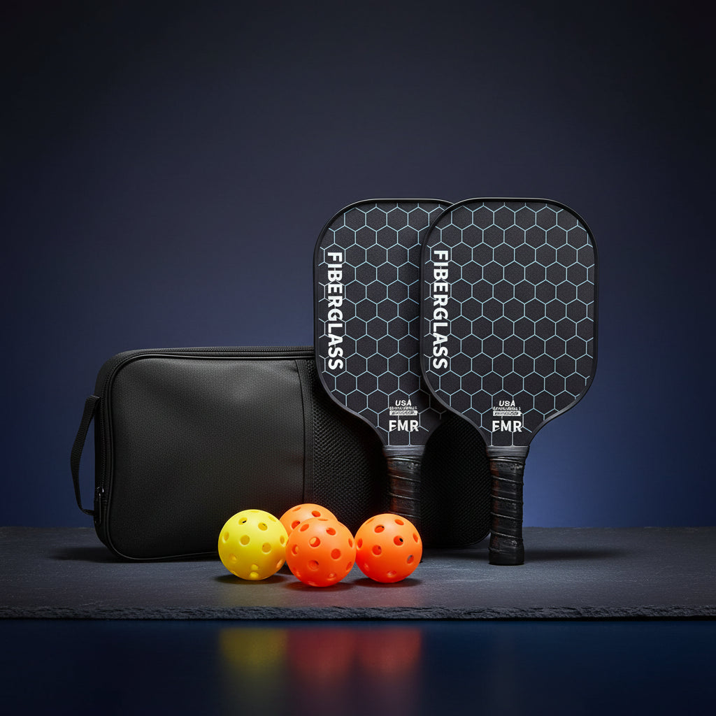 Two pickleball paddles with a black carrying case and colorful balls on a white background