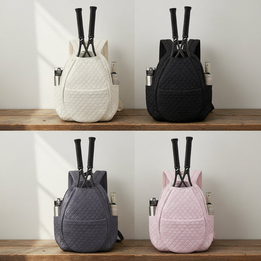 Four backpacks in different colors on a white background